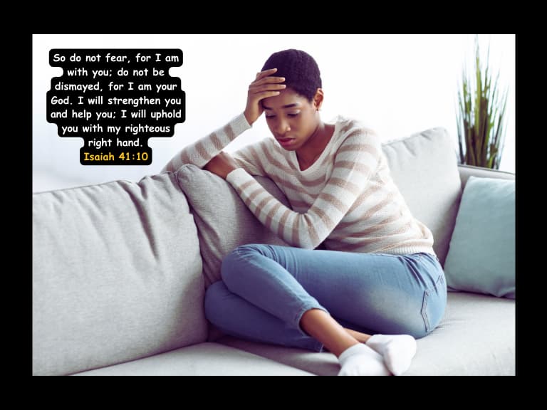 a black woman sitting with her hands in her head worried and  anxious full of fear with the bible verse  Isaiah 41:10 reassuring her through God's scripture she will peace and calm