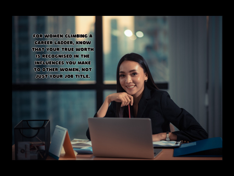my self worth is low quote with a strong woman sitting at a desk wearing a black boss lady suit smiling with a positive mindset